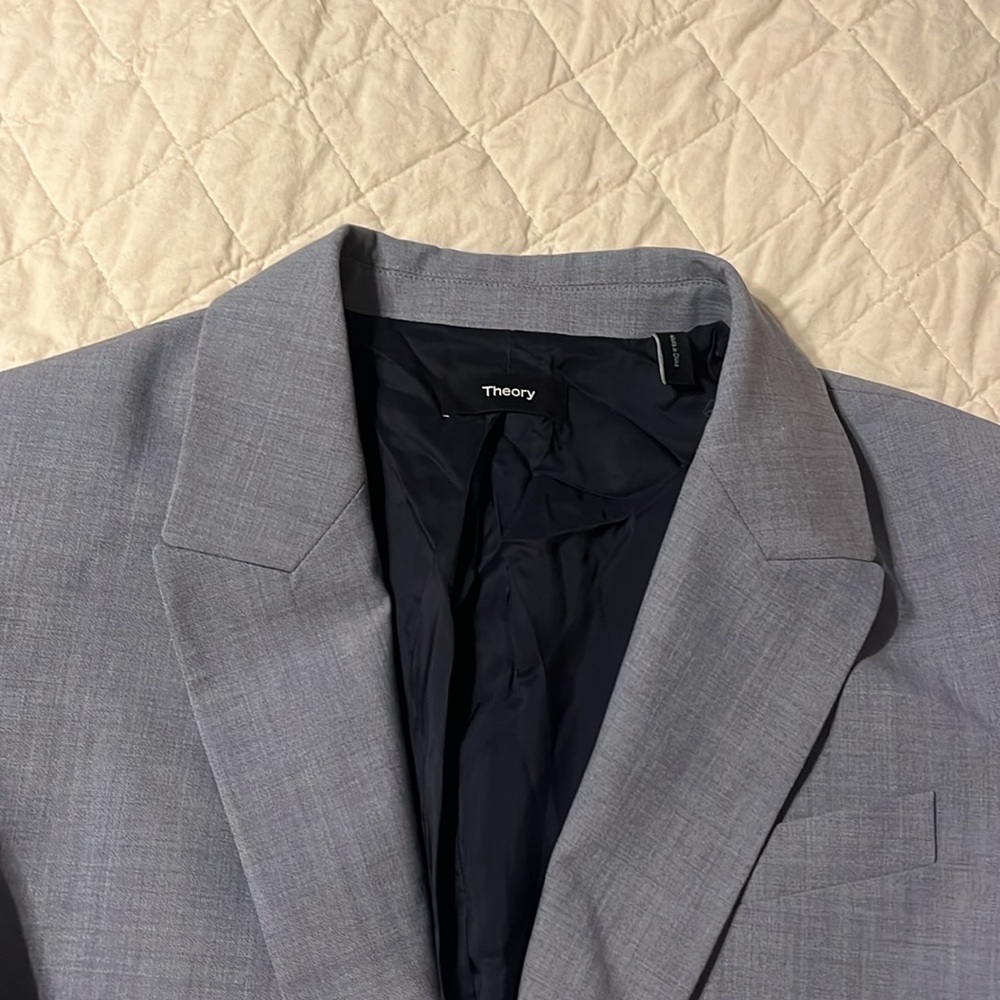 Theory grey wool blazer with padded shoulders and notched lapels. Like new